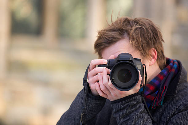 istock Photographer taking a photo with a digital SLR camera 530877185