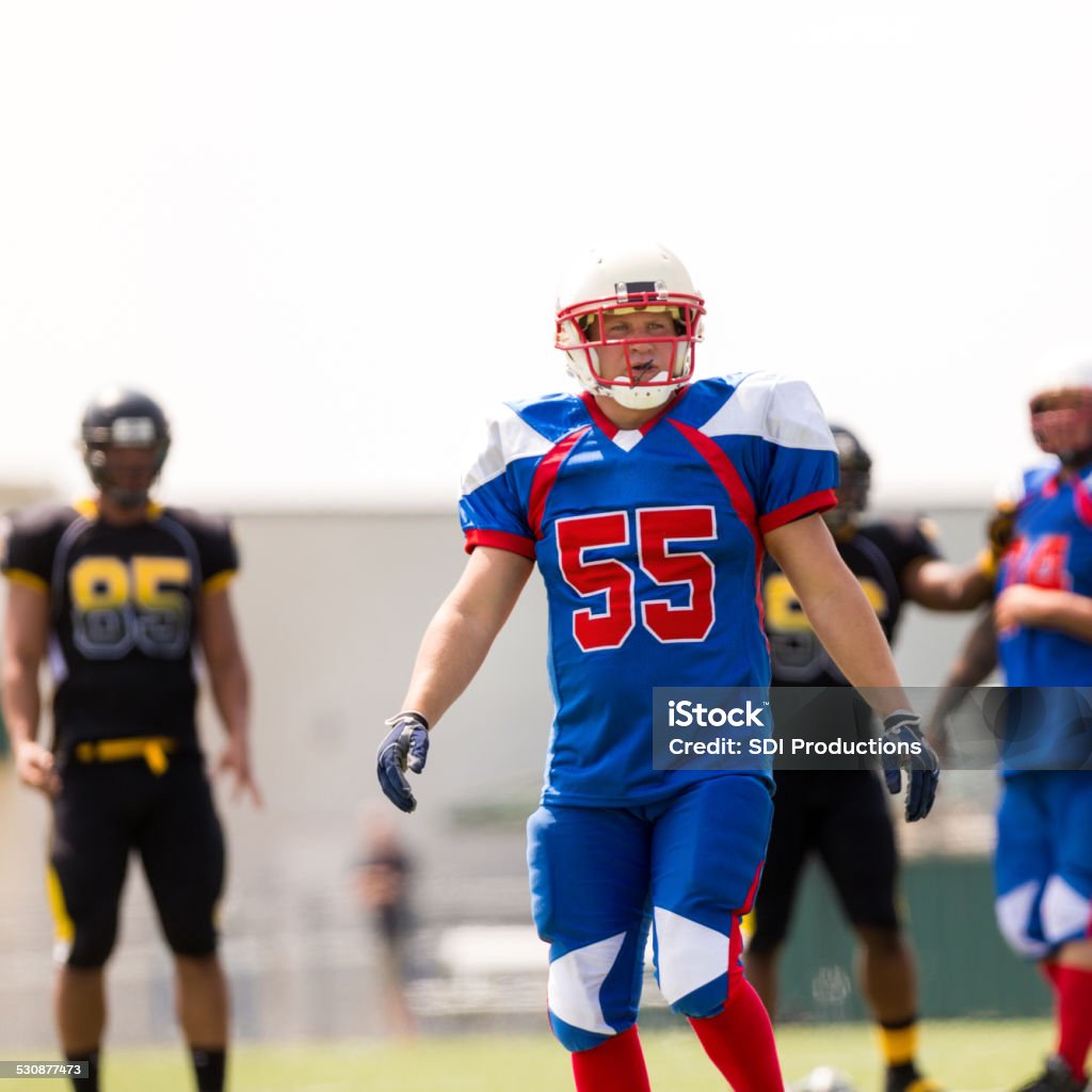 Professional football player playing game on field Activity Stock Photo