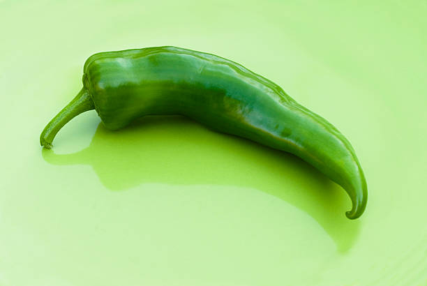 anaheim chili on green Freshly picked, raw Anaheim chili pepper anaheim pepper photos stock pictures, royalty-free photos & images