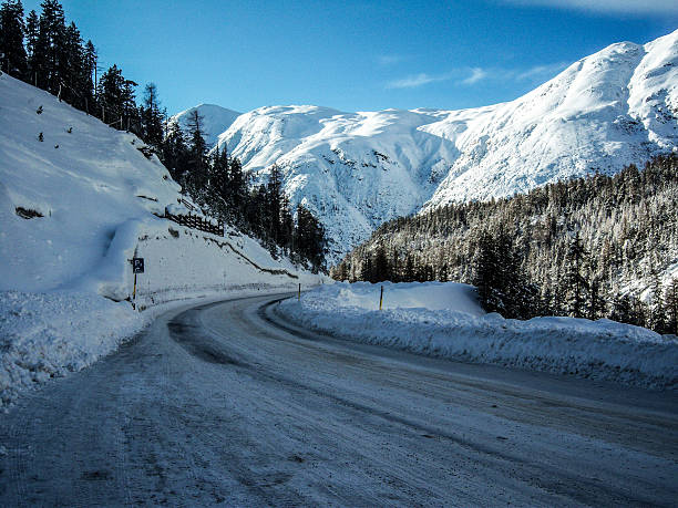 istock snowy mountain road 530884349
