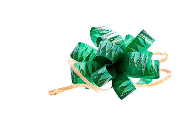 istock Gift ribbon green bow isolated over white background 530884699