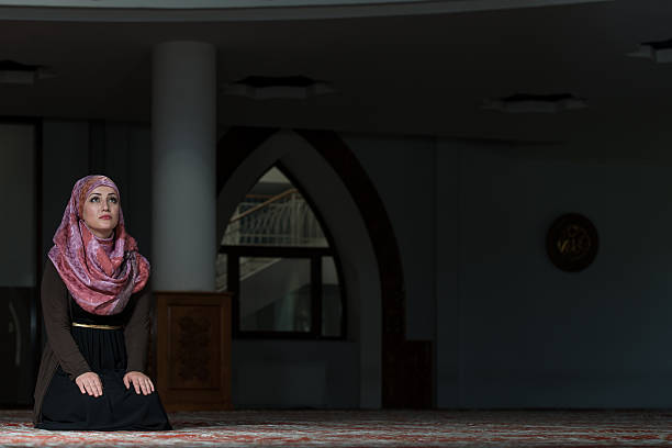 istock Muslim Woman Praying In Mosque 530886253