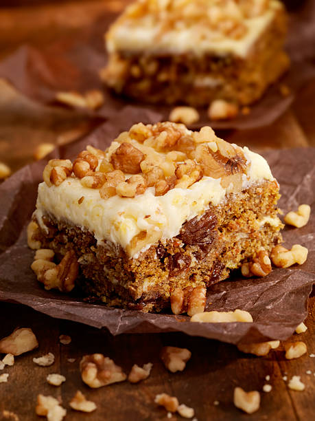 Carrot Cake Carrot Cake with Walnuts -Photographed on Hasselblad H3D2-39mb Camera Carrot Cake stock pictures, royalty-free photos & images