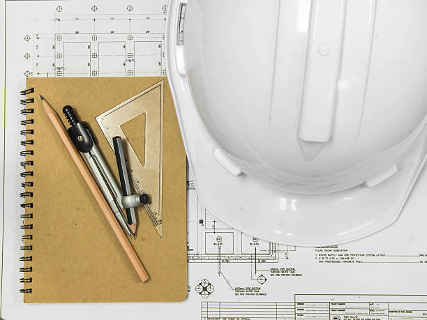 istock Architectural blueprint of office building with a pencil ,notebo 530889447