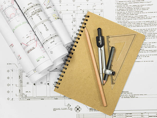 istock Architectural blueprint of office building with a pencils 530889465
