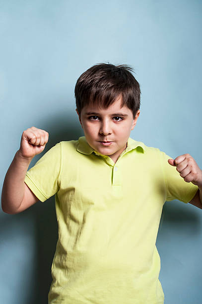 boy lucha - furious blue little boys caucasian fotografías e imágenes de stock