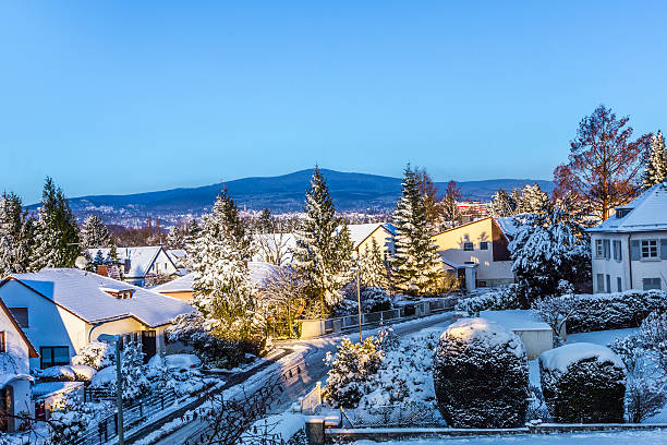 istock snow coverede houses and mountains in Schwalbach 530890697