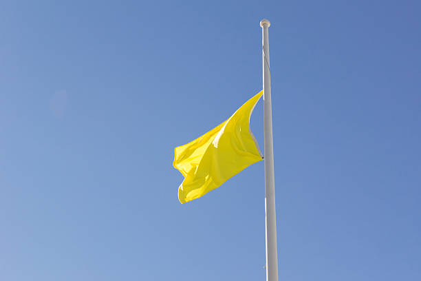 istock Yellow Flag at Half Mast 530900525