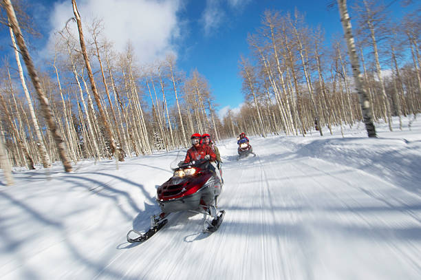 istock Couples Racing on Snowmobiles 530902441