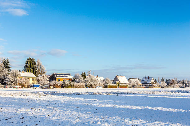 istock snow covered fields with settlement at the horizon in Munich 530903325