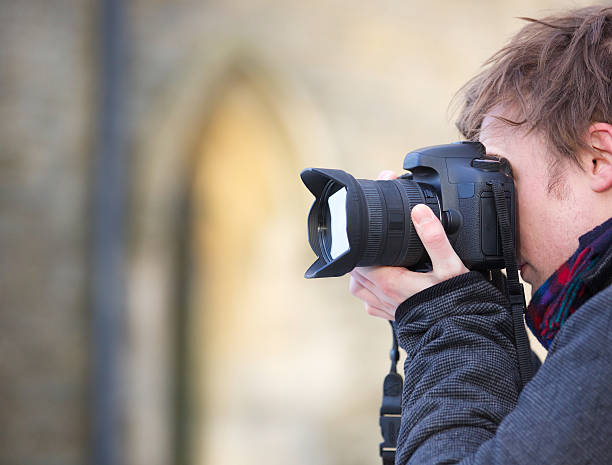istock Photographer taking a photo with a digital SLR camera 530905161