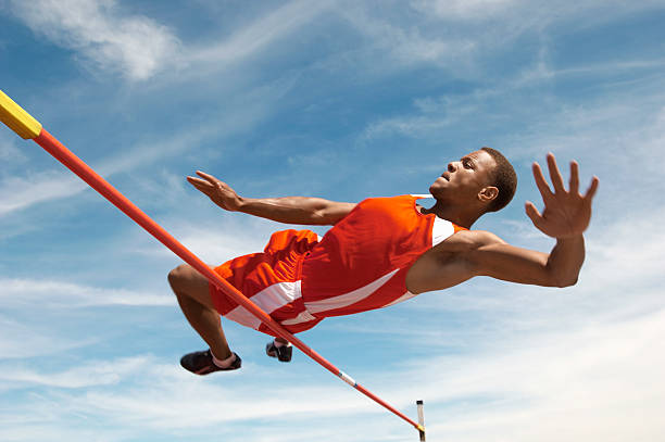 高跳び選手クリアバー - high jump 写真 ストックフォトと画像