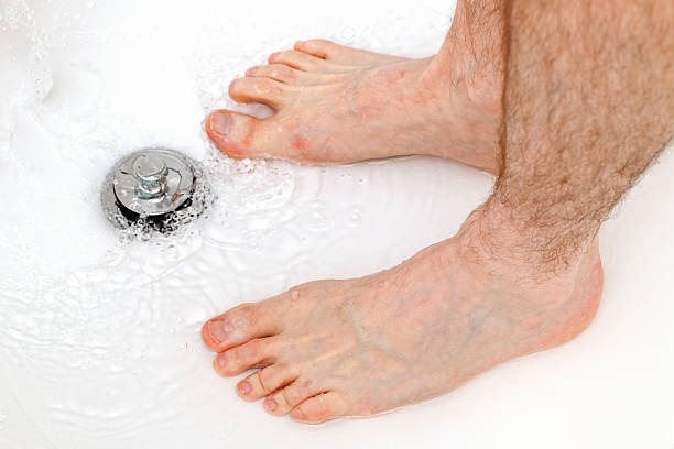 istock Feet in the Shower 530905535