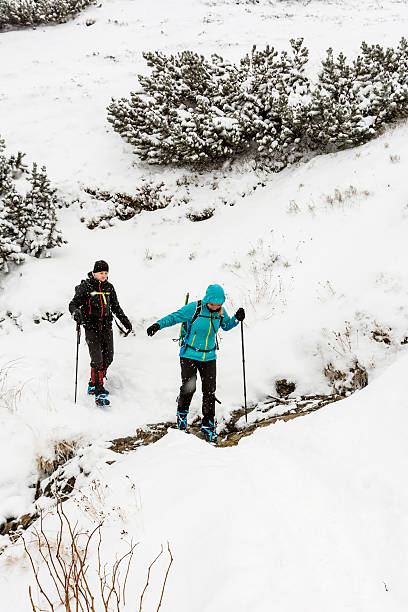 istock Hikers overcome the stream on the trail 530907061