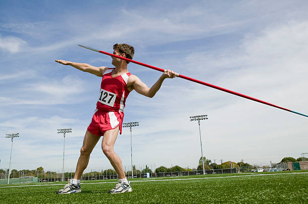 Male athlete holding javelin Male athlete holding javelin javelin stock pictures, royalty-free photos & images