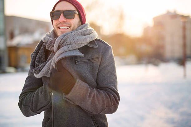 Urban man Young man standing in the street winter coat stock pictures, royalty-free photos & images