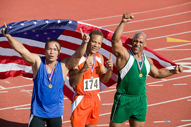 istock Three male athletes enjoying victory 530917131