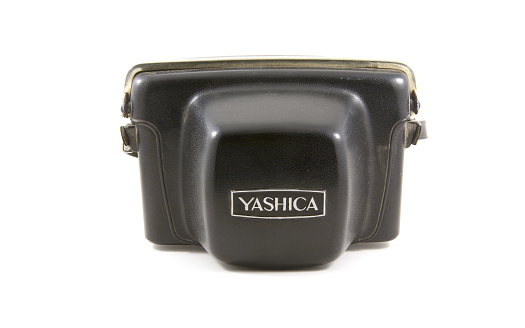 Vancouver, Canada - January 2, 2015: A vintage Yashica camera case isolated on white background. Yashica was a Japanese manufacturer of cameras created in 1949. 