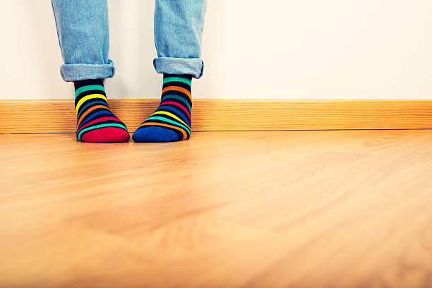 istock Female feet in colored socks 530919313