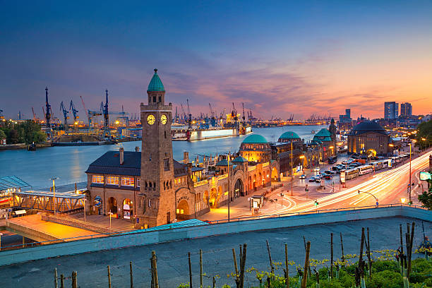 Hamburg, Germany. Image of Landungsbruecken and the harbor at sunset in Hamburg, Germany. hamburg stock pictures, royalty-free photos & images