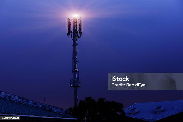 Light Atop Cellphone Tower At Night Stock Photo - Download Image Now - Night, Communications Tower, Tower