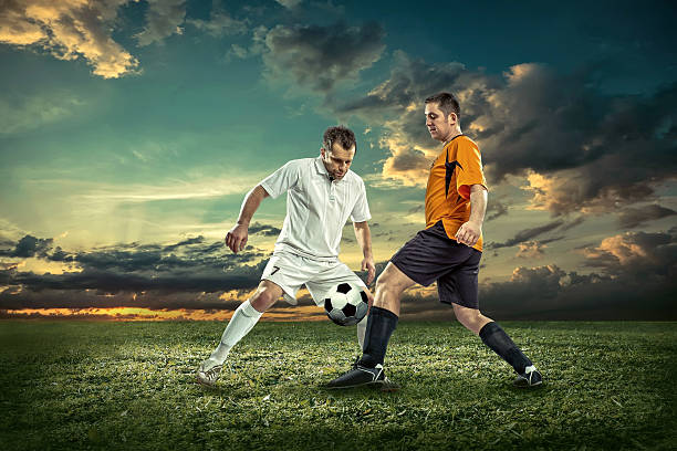 istock Soccer player with ball in action outdoors. 530924924