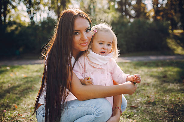 istock young family walking in the park 530924978