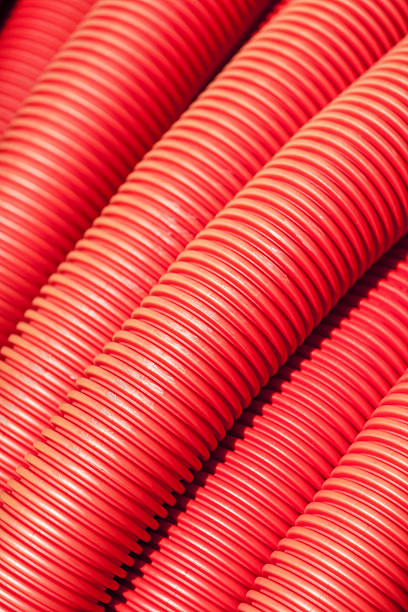 istock Tubing. Red plumbing pipe close-up. 530925524