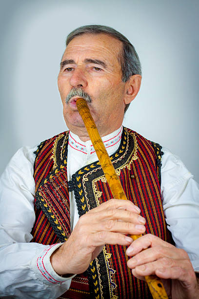 istock Pipe player in traditional clothing 530927857