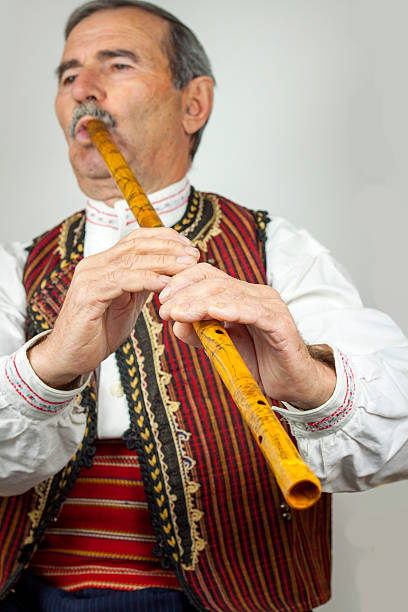 istock Pipe player in traditional clothing 530927867