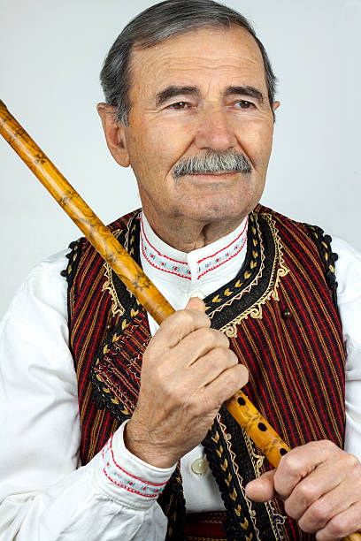 Pipe player in traditional clothing