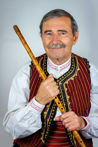 istock Pipe player in traditional clothing 530927985