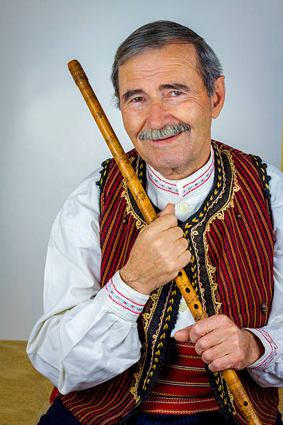 istock Pipe player in traditional clothing 530927987