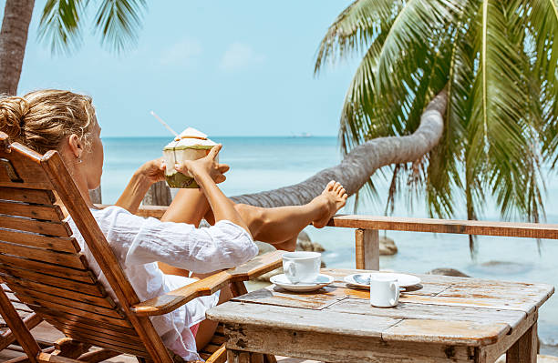 istock Young woman enjoys drinking coffee and coconut 530928332