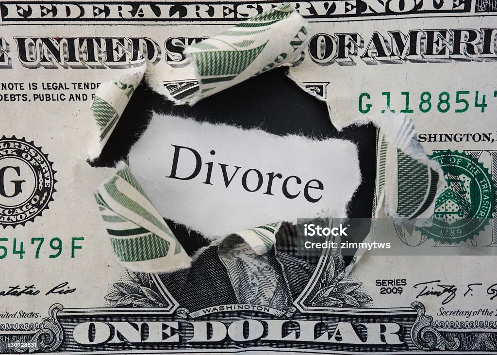 Divorce rip Hole ripped in a dollar bill with Divorce text Divorce Stock Photo