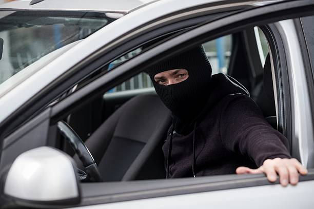 istock Car Thief gets into a stolen car 530929362