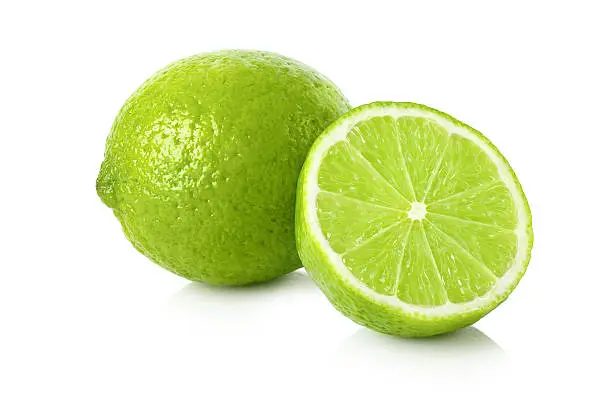 Ripe lime with a half on white background