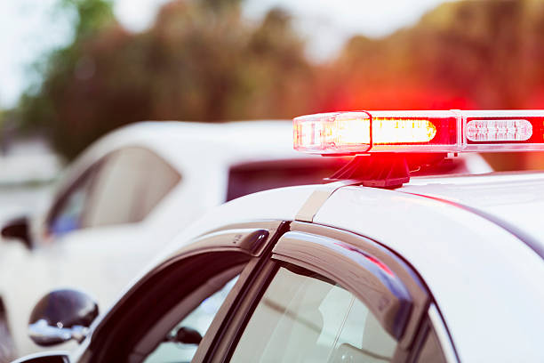 istock Police car with lights flashing making traffic stop 530930207