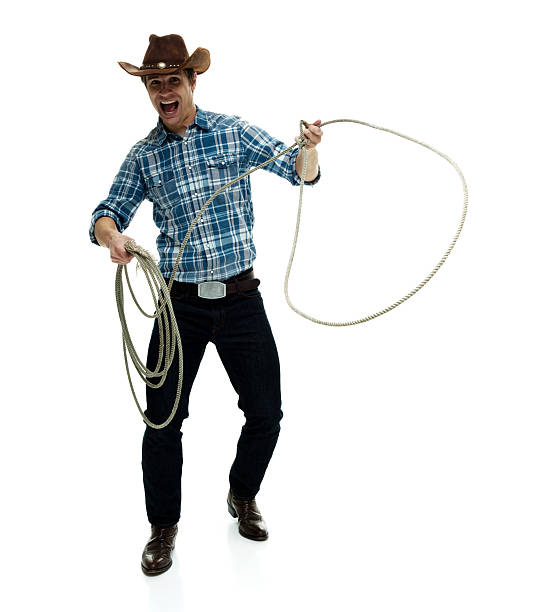 istock Cheerful cowboy lassoing 530930280