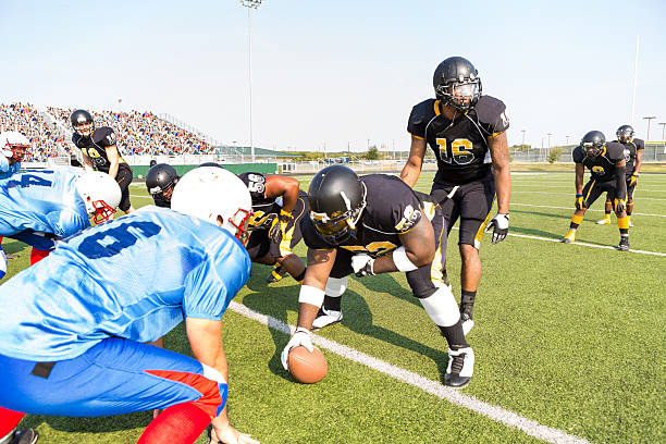 istock Professional football teams preparing for play during game at stadium 530930507