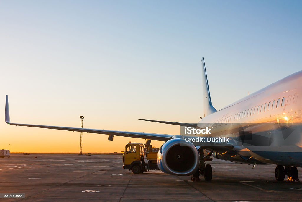 Aircraft maintenance in the morning airport apron Airplane Stock Photo