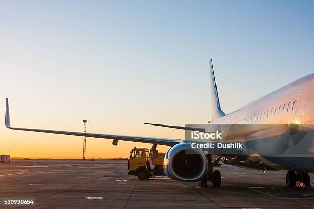 Aircraft Maintenance In The Morning Airport Apron Stock Photo - Download Image Now - Airplane, Air Vehicle, Land
