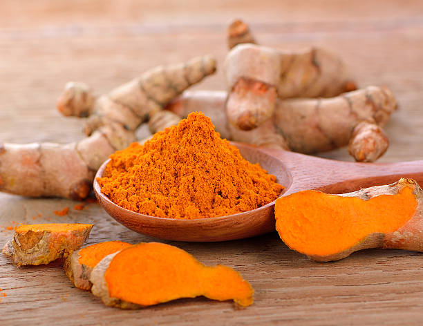 istock Fresh Turmeric and turmeric powder on white background 530931314