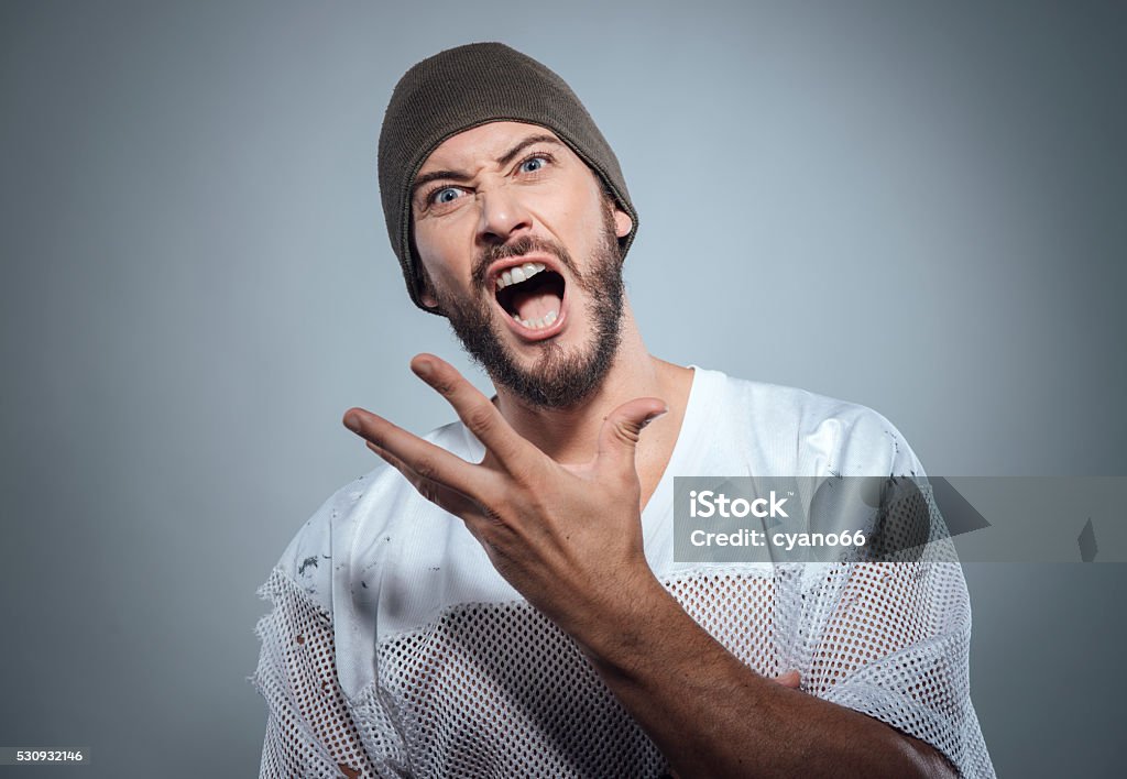 Bad boy Aggressive bad boy gesturing with strong attitude Adult Stock Photo