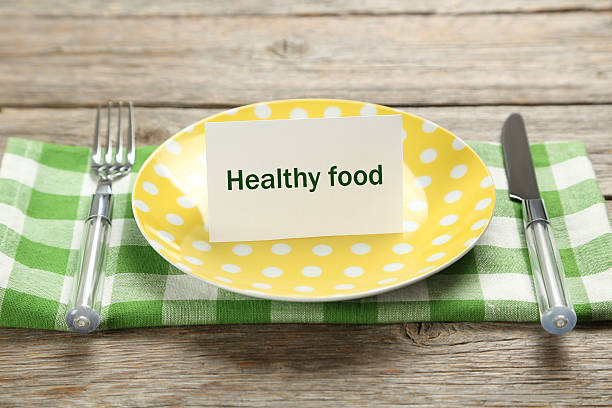 istock Yellow plate on a grey wooden table 530932738