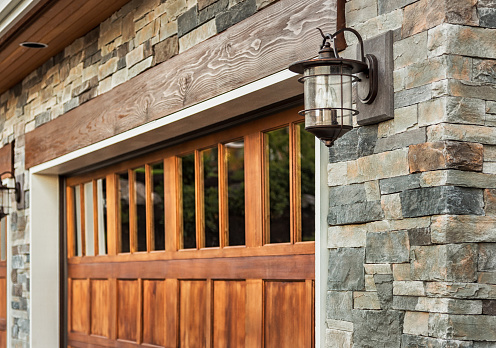 Garage door with stone work and light