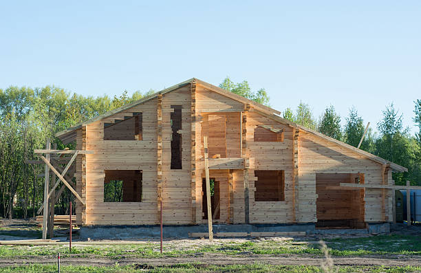 istock Unfinished wooden timber house under construction 530933624