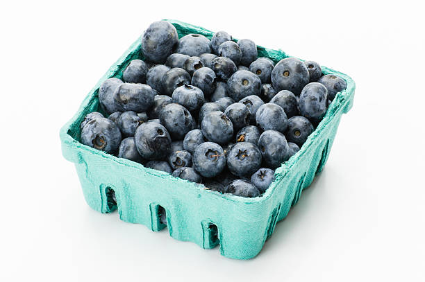 istock Pint container of blueberries on white 530933683