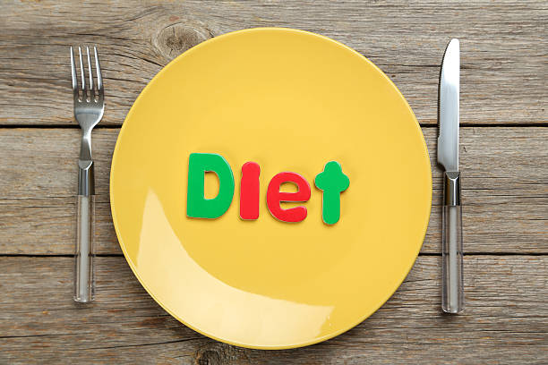 istock Yellow plate on a grey wooden table 530934600