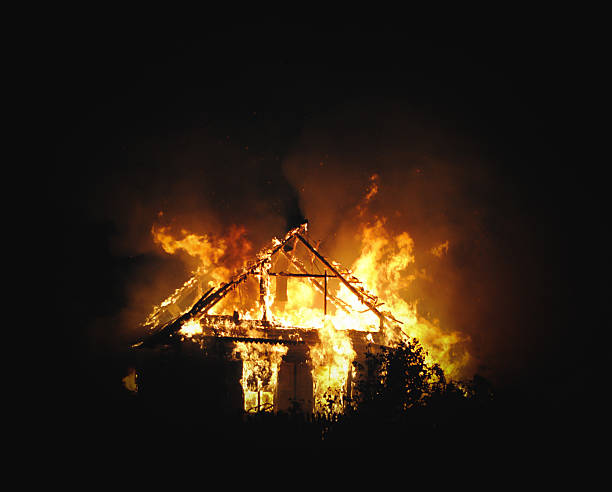 Burning house Building in full flaming inferno. burning house stock pictures, royalty-free photos & images